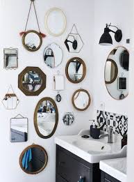 A Collection Of Different Mirrors On A Bathroom Wall Creative Wall Decor Vintage Mirror Wall Mirror Decor