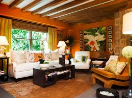 Tropical Orange Living Room With Exposed Beam Ceiling Tropical Living Room Living Room Orange Beige Living Rooms