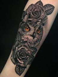 Little baby owl with a puzzle on the breast. 12 Best Owl And Rose Tattoo Designs Petpress
