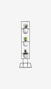 You can start with a spring loaded closet hanging rod and mount plant holders to it. 9 Best Vertical Plant Hanging Ideas The Strategist