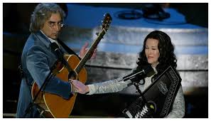 Speaking of the brilliantly funny Christopher Guest film "A Mighty Wind",  the late-great actress Catherine O'Hara learned to play the autoharp for  her role as folk singer Mickey Crabbe. O'Hara not only