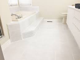 How I Painted And Stenciled My Old Outdated Tile Floor Painting Bathroom Tiles Tile Floor Diy Painted Bathroom Floors