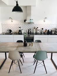 Vintage Modern White Kitchen Featuring White Cabinets Black Quartz Countertops Subway Tile Backsplash Home Kitchens Modern Kitchen Interiors Kitchen Interior