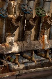 Antique fountain in antique plumbing products. Old Rusty Pipes And Valves In Cellar Of Stock Image Colourbox