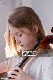 Girl Playing Viola High-Res Stock Photo
