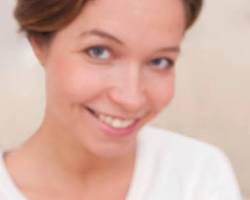 Image of woman holding a positive pregnancy test