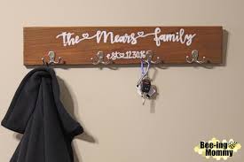 I bought a few two packs of wooden hangers from the poundstore, used a sharpie for the lettering, then used a £4 set of acrylic paints and used a brush i already had to make these, i'm quite proud of them! Personalized Wood Coat Rack