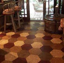 Installing cork tile floors is one of the cheapest ways to achieve a natural look on your flooring. Cork Flooring In Honeycomb Hexagonal Tiles Sustainable Flooring Eco Friendly Beautiful Cork Flooring Natural Cork Flooring Sustainable Flooring