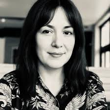 Along the Dark axis, from Grim to Noble and back. Current series is  grimdark (it's kind of hard to imagine proper cyberpunk/dystopian that  isn't) but the WIP has wandered into Nobledark territory.