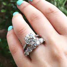 Top 10 Don Ts For Buying An Engagement Ring Eternity Band Engagement Ring Round Diamond Engagement Rings Amazing Wedding Rings