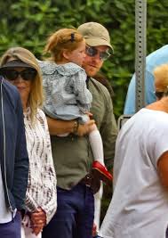 Prince Harry holds Princess Lilibet on Fourth of July outing