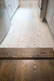 It provides the foundation and tone for the room. Hardwood Floor To Herringbone Tile Transition Bathroom Remodel Master Home Remodeling Chevron Tiles Floor