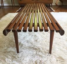 The tables are available in different sizes to coordinate with other furniture pieces, serving as a spot for flowers, a small lamp, or a coffee mug. Solid Wood Slat Coffee Table George Nelson Style Epoch