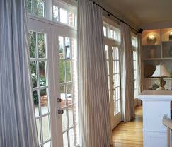 On the windows the valance is echoed with hunter douglas silhouettes covering the windows. Patio French Door Curtain Ideas