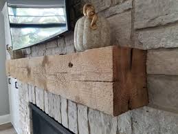 The rods need to be mounted solidly, either through the wood framing or through the stone, or both if possible, and close to each end of the mantel. Reclaimed Fireplace Mantel Elmwood Reclaimed Timber