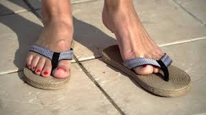 Woman feet with blue flip flops, beach and sea in the background, panoramic. Women Wearing Flip Flops Stock Video Footage 4k And Hd Video Clips Shutterstock