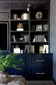 Black Built In Tv Cabinets And Shelves Create A Custom Design In This Alluring Dark Living Room Cabinetry Living Room Living Room Built Ins Built In Tv Cabinet