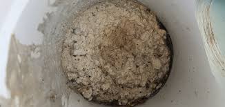 how to remove concrete from drain pipes