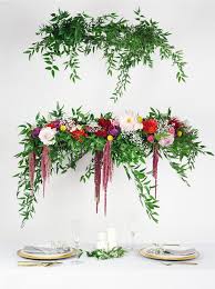 A hanging diy flower wall is an elegant decor feature that's simple to make and perfect for incorporating fresh flowers. How To Diy A Wedding Flower Chandelier Woman Getting Married
