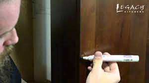 Using a soft fill stick How To Use Touch Up Pens To Fix Cabinet Nicks Scratches Youtube