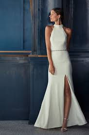 You find a beach, throw on a dress or lightweight suit, skip the shoes, and get ready for a tropically themed walk down the aisle. Montreal Crepe Maxi Dress Bhldn