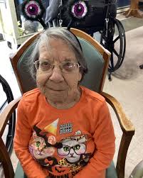 We played bingo, received a Plinko chip, then played Plinko to receive  prizes at Dennett Rehab Center! Cookies that resembled bats were served as  a snack. Crystal (therapy dog) and owner also