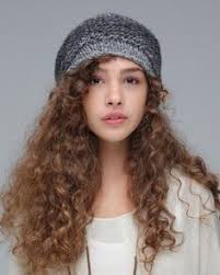 Curly hair bangs on textured hair or straight bangs worn on curly hair are just a few trendy ways to have fun with a fringe. Curly Hair W Beanie Curly Hair Styles Curly Hair Styles Naturally Hair Styles
