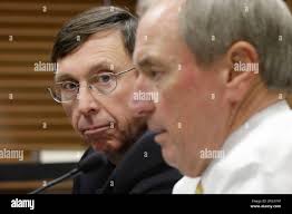 Sam Ledbetter, Chair, Arkansas State Board of Education, left, listens to  comments about the state takeover of the Little Rock school district by  Tony Wood, Commissioner, Arkansas Department of Education, right, during