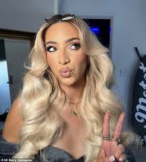 GK Barry flaunts her jaw-dropping figure in a VERY skimpy bodysuit and  stockings before slipping into a sexy maid costume for Ann Summers' new  Halloween campaign