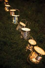 15 Gorgeous Ways To Light Up Your Backyard The Art In Life Tin Can Lanterns Diy Lanterns Can Lanterns