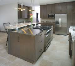Constructed of solid hardwood and wood veneers, the cambridge stainless steel top kitchen island is designed for longevity. Mullet Cabinet Kitchen Island With Cooktop Kitchen Design Diy Kitchen Island