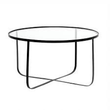 With silver frame finish this round glass coffee table from southern enterprises is perfect to place in the homes, offices or the laws or patios. Bloominville Round Glass And Metal Coffee Table Harper Tempered Glass Table