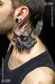 There's no doubt about what this individual thinks about society and its rules. Skull Graphic Tattoo Design On Neck Ink Neck Tattoo For Guys Neck Tattoo Neck Tattoos Women