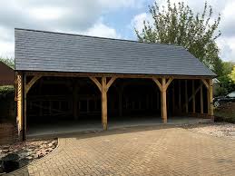 The open, roofed structures can shield automobiles, motorcycles, boats and other vehicles from the elements. Oak Framed Garages By Shires Oak Buildings