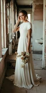 Simple Wedding Dresses For Elegant Brides Modest Wedding Dresses Wedding Dress Guide Wedding Dresses