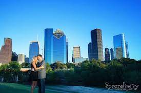 Open spaces and neighborhood parks with a view of the western downtown skyline are ideal. Houston Downtown Eleanor Tinsley Park Outdoor Engagement Pictures Houston Photography Downtown Photography