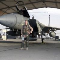 Participating in Operation SOUTHERN WATCH, Brigadier General Allen Peck,  USAF, 363rd Air Expeditionary Wing Commander poses in front of his F-15  Eagle prior to his 100th flying hour in combat at Prince