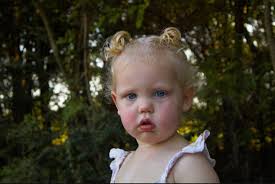 Adorable baby girl with curly hair