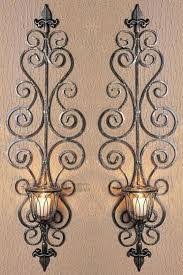 We believe these are baldwin brass, as they're from the estate of a collector of baldwin metalware. 32 Wall Mounted Candle Holders Ideas Wall Candles Candle Holders Iron Decor