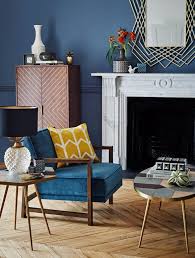 A glass coffee table makes for an elegant, subtle addition to the room, while a coffee table with storage is perfect for creating space for a striking centerpiece. Blue Velvet Armchair From House Of Fraser Mad About The House