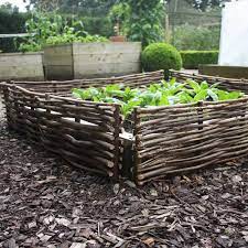 Planting the stone edging was otherwise not scientific. These Tough And Durable Hazel Borders Are The Ideal Way To Create That Traditional English Garden English Country Gardens Country Gardening Landscape Projects