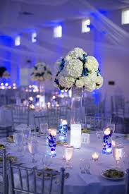 White And Silver Reception Decor With Blue Uplighting Blue Wedding Centerpieces Blue Wedding Decorations Blue Wedding Receptions