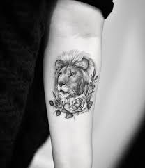 Pretty Black And Grey Tattoo Of Lion And Flowers Motive Done By Tattoo Artist Dragon Art Leopard Tattoos Tattoos Lion Tattoo