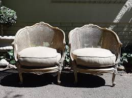 A Pair Of Gilded Rattan Arm Bergere Style Chairs The Crown Collection Chair Rattan Bergere