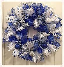 This wreath is poof deco mesh wreath with ruffles and ribbonsupplies used:work wreath with blue tinsel ties21in deco mesh in blue and white2 rolls of 10in bl. Pin On Christmas Mesh Wreaths