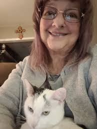 Trying real hard to wrap Christmas presents!!