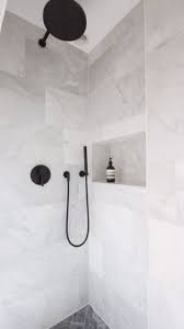 Black And White Bathroom Wall Tile Designs White Marble Shower With Black Dornbracht Tapware And Herringbone Marble Flooring Bathroom Tile Designs Marble Bathroom Floor Black Marble Bathroom