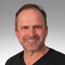 Gregory L Schumacher, MD