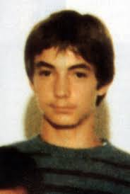 Image of RELATIVE OF REBEL ROLY ROJAS POSED WITH T-SHIRT AND PHOTOS,