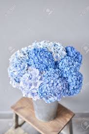 Remove the flowers from the box, cut the stems, and place them in a vase with fresh water and a flower food packet. Beautiful Blue Hydrangea Flowers In A Vase On A Table Bouquet Of Light Pink Flower Decoration Of Home Wallpaper And Background Stock Photo Picture And Royalty Free Image Image 149889311